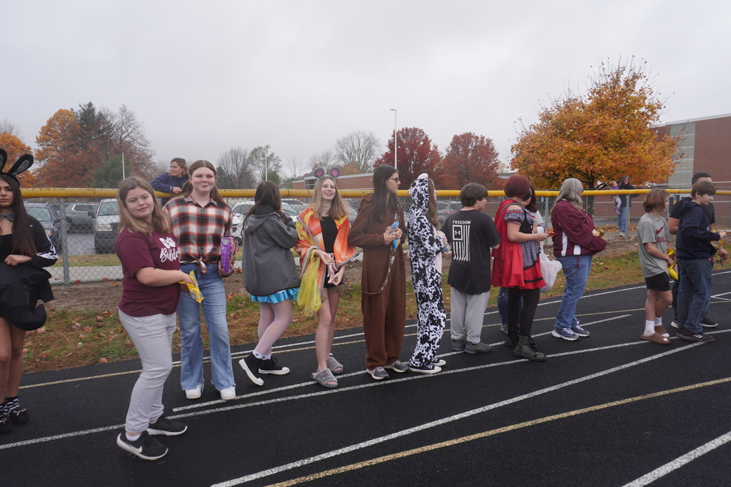 Mrs. Burrow's class lined up on the track to pass out candy